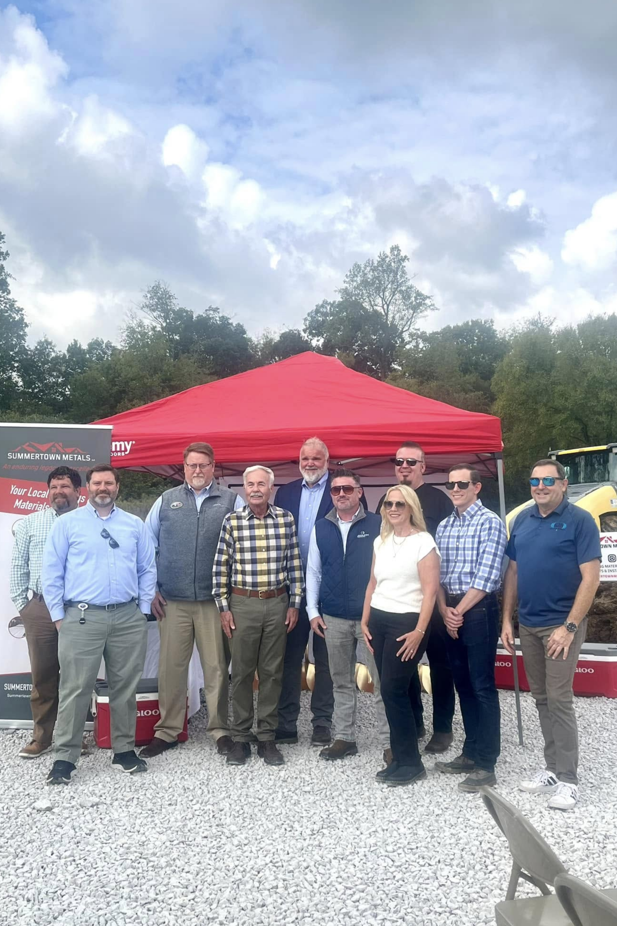 Family celebrating at the groundbreaking ceremony for Thompson's Station Hardware, showing community support and excitement for the new local business