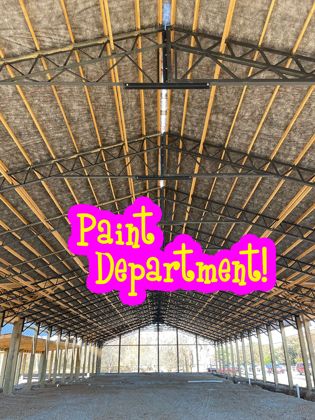 Interior view looking up at the completed roof structure of Thompson's Station Hardware in Franklin, TN, with Paint Department text overlay marking the future paint section location.